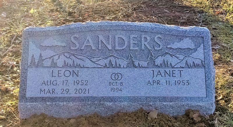 Sanders Memorial with Mountain Landscape Carving